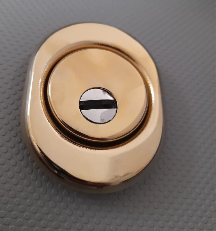 Merkproduct Defender per cilindri sagomati oro PVD 17536